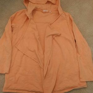 An orange and yellow cardigan with the hoodie